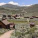 Historical wooden buildings scattered in a ghost town in California